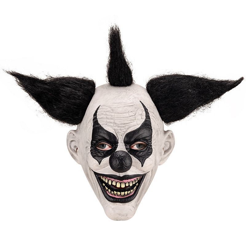 Latex clown mask detail shot — textured surface and painted features