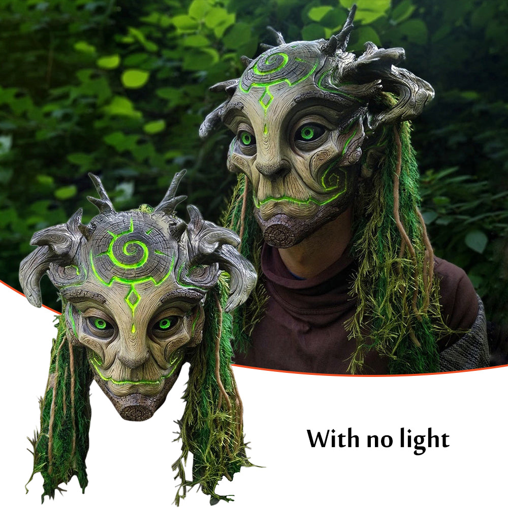 Fantasy masks with green accents and moss-like textures against a natural background.